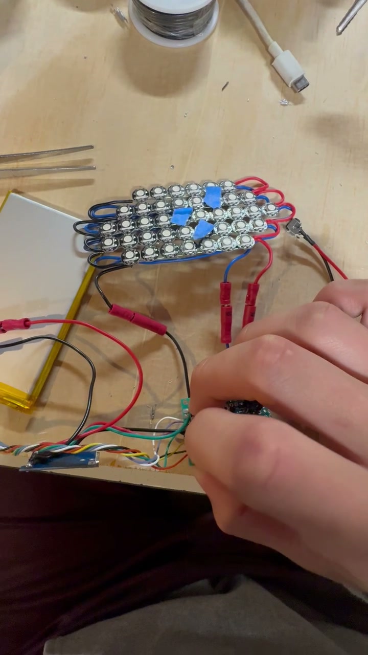 Proto 1 LED grid lighting up on the bench